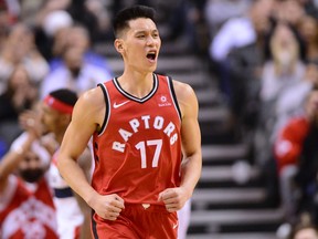 New Raptors guard Jeremy Lin, here celebrating a basket in his only game with the team so far, found his first practice last night “really, really weird.”  Frank Gunn/The Canadian Press