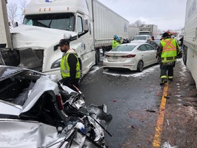 Emergency crews at the scene of a pileup on Hwy. 401 near Hwy. 25 in Milton on Feb. 13, 2019. (OPP_HSD/Twitter)