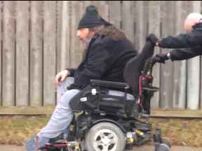 Peel Regional Police Const. Matthew Kerr pushed Jason Graves through the blistering cold to his home more than a kilometre away when his wheelchair battery died in Mississauga on Jan. 8, 2019. (photo supplied by Peel Regional Police)