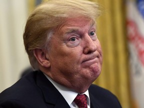 U.S. President Donald Trump listens as he meets with Chinese Vice Premier Liu He at the White House in Washington, Thursday, Jan. 31, 2019.