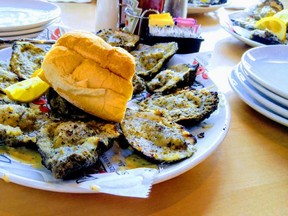 A plate of delicious charbroiled oysters at Drago's in New Orleans. (DAVE POLLARD/Postmedia Network)