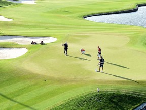 Dustin Johnson of the USA celebrates on the 18th green during the final round of the Saudi International at the Royal Greens Golf & Country Club on Feb. 3, 2019 in King Abdullah Economic City, Saudi Arabia.