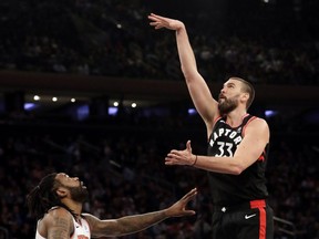 Marc Gasol (right), the Raptors’ prized trade-deadline acquisition, shoots over the Knicks’ DeAndre Jordan during the first half of Saturdays game in New York.  AP Photo