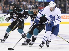 Toronto Maple Leafs centre Frederik Gauthier (33) plays the puck as Anaheim Ducks defenceman Korbinian Holzer (5) tries to defend in Toronto on Monday, February 4, 2019. (THE CANADIAN PRESS/Nathan Denette)