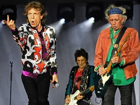 (L/R): British musicians Mick Jagger, Ronnie Wood and Keith Richards of The Rolling Stones perform during a concert at The Velodrome Stadium in Marseille on June 26, 2018, as part of their 'No Filter' tour. (Photo by Boris HORVAT / AFP)        (Photo credit should read BORIS HORVAT/AFP/Getty Images)