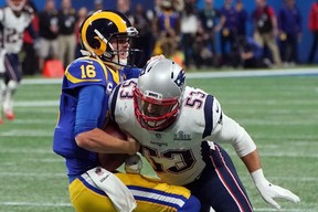 Los Angeles Rams quarterback Jared Goff is tackled by New England Patriots linebacker Kyle Van Noy during Super Bowl LIII at Mercedes-Benz Stadium in Atlanta on February 3, 2019. (TIMOTHY A. CLARY/AFP/Getty)
