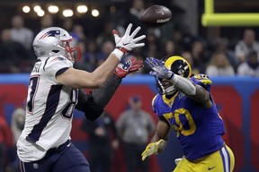 New England Patriots tight end Rob Gronkowski (87) catches a pass in front of Los Angeles Rams defender Cory Littleton (58) during Super Bowl LIII Sunday, Feb. 3, 2019, in Atlanta.(AP Photo/Patrick Semansky)