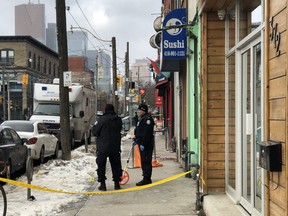 Toronto Police at the scene outside a nightclub on Queen St. E. on Friday, Feb. 8, 2019 after a man was fatally shot. (Ernest Doroszuk/Toronto Sun)