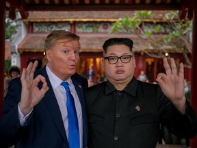 Hong Kong-based Kim Jung-Un impersonator 'Howard X', and Donald Trump lookalike 'Russell White' from Canada are seen visiting and posing for photos at Ngoc Son Temple on Hoan Kiem Lake on February 22, 2019 in Hanoi, Vietnam. (Linh Pham/Getty Images)