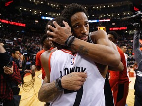 DeMar DeRozan hugs long-time teammate and close friend Kyle Lowry after DeRozan's return to Toronto. Jack Boland/Toronto Sun