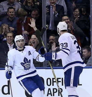Maple Leafs centre John Tavares (left) scores in the second period against the Ducks during NHL action in Toronto on Monday, Feb. 4, 2019.