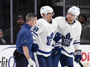 Maple Leafs  Andreas Johnsson is helped off the ice after colliding with Brayden McNabb of the Vegas Golden Knights on Thursday. Johnsson missed Saturday's game against Arizona but plans to be back Tuesday against St. Louis. (Ethan Miller/Getty Images)