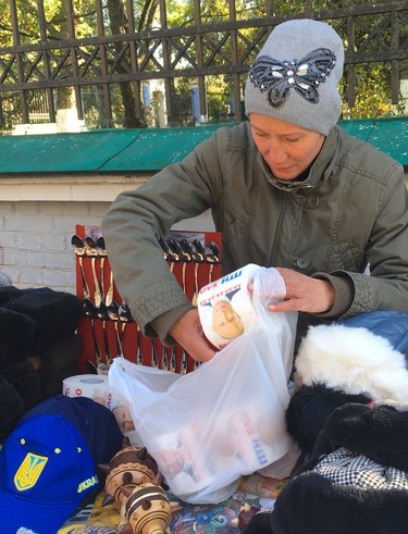 A large outdoor market near St. Andrew's Church in Kyiv, Ukraine, offers an assortment of souvenirs including toilet paper with Russian President Vladimir Putin's image on each sheet. (Chris Doucette/Toronto Sun/Postmedia Network)