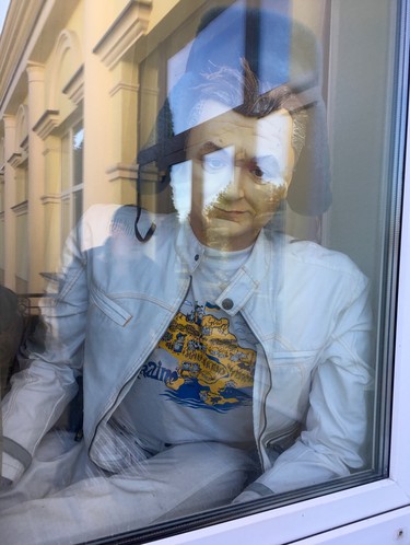 A dummy made to look like former Ukrainian president Viktor Yanukovych sits in a window of the mansion where he lived with his mistress until his ouster in 2014. (Chris Doucette/Toronto Sun/Postmedia Network)
