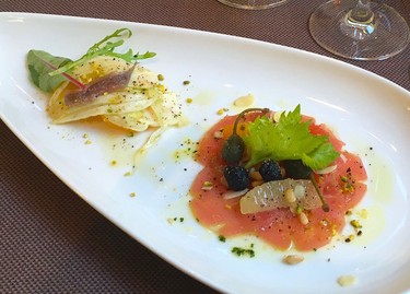 An appetizer of thinly sliced raw tuna with sun-dried olives and oranges, and anchovies with fennel and oranges prepared by Teatro Restaurant's award-winning chef Gaetano Sgroi at the Opera Hotel in Kyiv, Ukraine. (Chris Doucette/Toronto Sun/Postmedia Network)