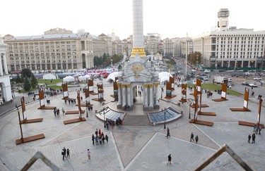 Independence Monument, a victory column, in the centre of Kyiv's Maidan (square) is surrounded by graphic images of Euromaidan, the 2014 revolution that led to the ouster of Ukraine's former president Viktor Yanukovych. (Chris Doucette/Toronto Sun/Postmedia Network)