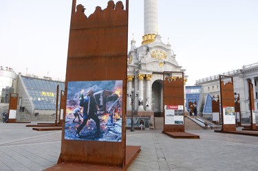 Independence Monument, a victory column, in the centre of Kyiv's Maidan (square) is surrounded by graphic images of Euromaidan, the 2014 revolution that led to the ouster of Ukraine's former president Viktor Yanukovych. (Chris Doucette/Toronto Sun/Postmedia Network)