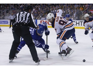 Edmonton Oilers Connor McDavid C (97) wins the draw off of Toronto Maple Leafs William Nylander RW (29) during the first period in Toronto on Wednesday February 27, 2019. Jack Boland/Toronto Sun/Postmedia Network