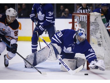 Toronto Maple Leafs Frederik Andersen G (31) pounces on the puck before Edmonton Oilers Ryan Nugent-Hopkins. C (93) can get to it during the second period in Toronto on Wednesday February 27, 2019. Jack Boland/Toronto Sun/Postmedia Network