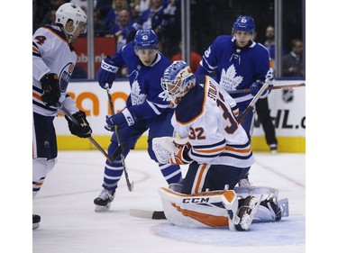 Edmonton Oilers Anthony Stolarz G (32) makes a save on a tip by Toronto Maple Leafs Trevor Moore C (42) during the third period in Toronto on Wednesday February 27, 2019. Jack Boland/Toronto Sun/Postmedia Network
