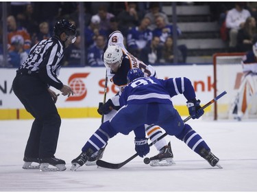 Edmonton Oilers Connor McDavid C (97) wins the draw against  Toronto Maple Leafs John Tavares C (91)  during the second period in Toronto on Thursday February 28, 2019. Jack Boland/Toronto Sun/Postmedia Network