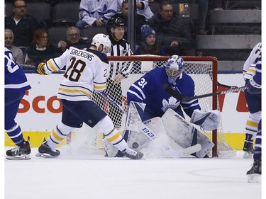 Buffalo Sabres Zemgus Girgensons C (28) can't corral the loose puck in front of Toronto Maple Leafs Frederik Andersen G (31) during the first period in Toronto on Monday February 25, 2019. Jack Boland/Toronto Sun/Postmedia Network