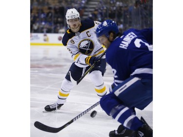 Buffalo Sabres Jack Eichel C (9) fires in a puck past Toronto Maple Leafs Ron Hainsey D (2) during the second period in Toronto on Monday February 25, 2019. Jack Boland/Toronto Sun/Postmedia Network