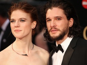 Actors Rose Leslie, left, and Kit Harrington pose for photographers upon arrival at the Olivier Awards in London, Sunday, April 3, 2016.