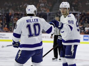 Tampa Bay Lightning's Mikhail Sergachev, right, and J.T. Miller celebrate Sergachev's goal during the first period of an NHL game against the Philadelphia Flyers, Tuesday, Feb. 19, 2019, in Philadelphia.