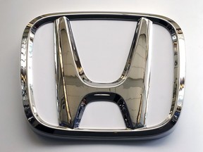 This Thursday, Feb. 14, 2019 file photo shows the Honda logo on a 2019 Honda Civic on display at the 2019 Pittsburgh International Auto Show in Pittsburgh.