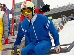 In this file photo dated Feb. 9, 1988, Matti Nykannen of Finland looks down the slope from the top of the ski jump during a practice session at the Calgary Winter Olympics.