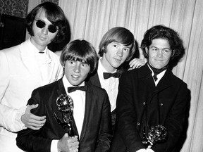 This June 4, 1967 file photo shows, from left, Mike Nesmith, Davy Jones, Peter Tork, and Micky Dolenz of The Monkees posing with their Emmy award for best comedy series at the 19th Annual Primetime Emmy Awards in Los Angeles.
