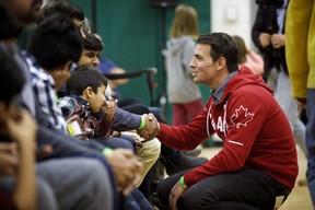 Adam van Koeverden, the Liberal candidate for southern Ontario riding of Milton greets people prior to Prime Minister Justin Trudeau’s town hall event in Milton, Ontario on Thursday, Jan. 31, 2019. THE CANADIAN PRESS/Cole Burston