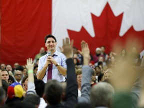 Prime Minister Justin Trudeau looks to the crowd as he takes questions at a town hall event in Milton, Ont. on Jan. 31, 2019.