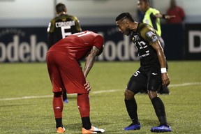Terrence Boyd of TFC hangs his head — and takes some taunting from a CAI player — after missing a penalty kick in Tuesday’s 4-0 loss in Panama.  AP