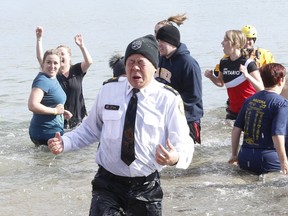 Toronto Police officers took part in their 3rd annual Polar Plunge at Sir Casimir Gzowski Park, raising over $35,000 for Special Olympics Ontario, on Saturday, Feb. 9, 2019. Depity Chief even joined in the chilly fun, although he doesn't look like he's enjoying himself. (Jack Boland/Toronto Sun/Postmedia Network)