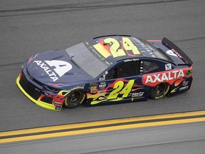 William Byron (24) makes his way through Turn 4 during qualifying for the Daytona 500 at Daytona International Speedway, Sunday, Feb. 10, 2019, in Daytona Beach, Fla. (AP Photo/Phelan M. Ebenhack)