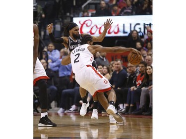 Toronto Raptors Kawhi Leonard SF (2) drives into San Antonio Spurs Patty Mills PG (8) during the second quarter in Toronto, Ont. on Friday February 22, 2019. Jack Boland/Toronto Sun/Postmedia Network