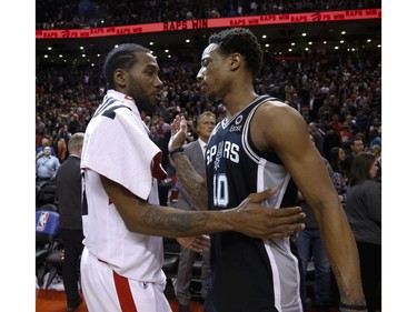 San Antonio Spurs DeMar DeRozan SG (10) talks to Toronto Raptors Kawhi Leonard SF (2) after game  in Toronto, Ont. on Saturday February 23, 2019. Jack Boland/Toronto Sun/Postmedia Network