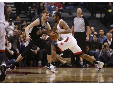 Toronto Raptors Kawhi Leonard SF (2) drives against San Antonio Spurs Davis Bertans SF (42) during the second quarter in Toronto, Ont. on Friday February 22, 2019. Jack Boland/Toronto Sun/Postmedia Network