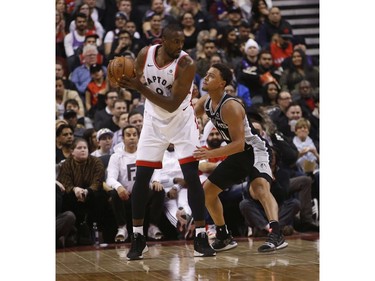 Toronto Raptors Serge Ibaka C (9) looks in on San Antonio Spurs Bryn Forbes SG (11) during the second quarter in Toronto, Ont. on Friday February 22, 2019. Jack Boland/Toronto Sun/Postmedia Network