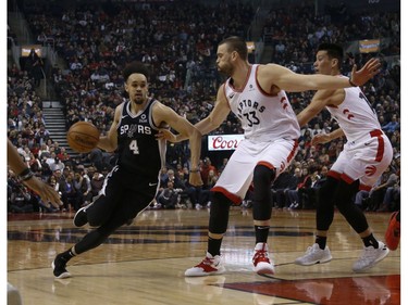 San Antonio Spurs Derrick White PG (4) drives  towards Toronto Raptors Marc Gasol C (33) during the second quarter in Toronto, Ont. on Saturday February 23, 2019. Jack Boland/Toronto Sun/Postmedia Network