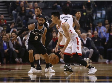 Toronto Raptors Jeremy Lin PG (17) is guarded by San Antonio Spurs Patty Mills PG (8) during the second quarter in Toronto, Ont. on Friday February 22, 2019. Jack Boland/Toronto Sun/Postmedia Network