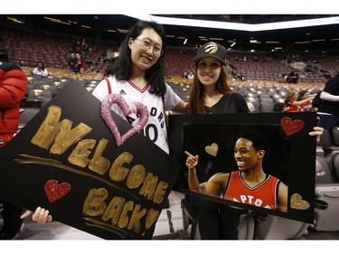 Sally Kan (L) and her friend Shaina Kawla were all happy for the return of their hero DeMar DeRozan, of the San Antonio Spurs in Toronto, Ont. on Friday February 22, 2019. Jack Boland/Toronto Sun/Postmedia Network