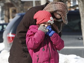 A mourning mom and daughter dropped off flowers and a birthday balloon to a home on Hansen Rd. N. in Brampton, where 11-year-old Riya Rajkumar was found slain Thursday, on Saturday, Feb. 16, 2019. (Jack Boland/Toronto Sun/Postmedia Network)