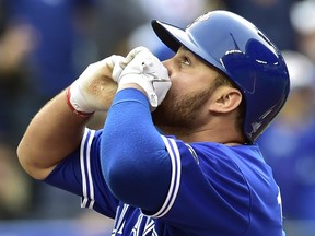 Blue Jays prospect Rowdy Tellez, shown celebrating his first career MLB home run last September, endured an emotional roller-coaster following the loss of his mother Lori after a long battle with brain cancer. (THE CANADIAN PRESS FILES)