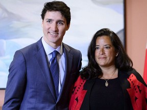 Prime Minister Justin Trudeau and Veterans Affairs Minister Jodie Wilson-Raybould attend a swearing in ceremony at Rideau Hall in Ottawa on Monday, Jan. 14, 2019.