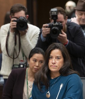 Cameras follow Jody Wilson Raybould as she waits to appear infront of the Justice committee in Ottawa, Wednesday, February 27, 2019. THE CANADIAN PRESS/Adrian Wyld