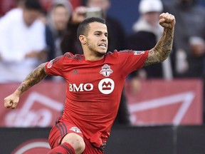 TFC's Sebastian Giovinco celebrates his penalty kick goal against the Chicago Fire during first half MLS soccer action in Toronto October 23, 2016.  THE CANADIAN PRESS/Frank Gunn