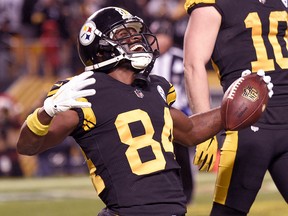Pittsburgh Steelers wide receiver Antonio Brown (84) celebrates after catching a touchdown pass against the New England Patriots in Pittsburgh, Sunday, Dec. 16, 2018. (AP Photo/Don Wright)